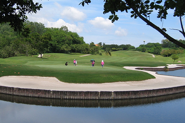 players on green, burapha golf club, pattaya, thailand